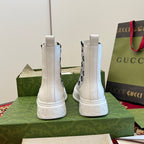 Gucci unisex ankle boots viewed from back, white with logo side elastic gores