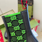 Black Chelsea boot with neon green GG-pattern elastic side panel.