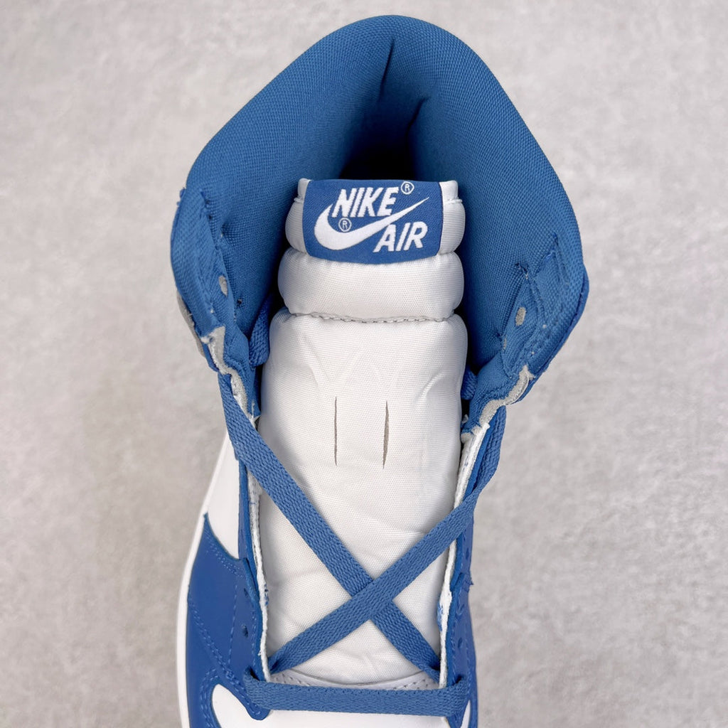High-top sneaker with white lining and Nike Air tongue label in blue collar