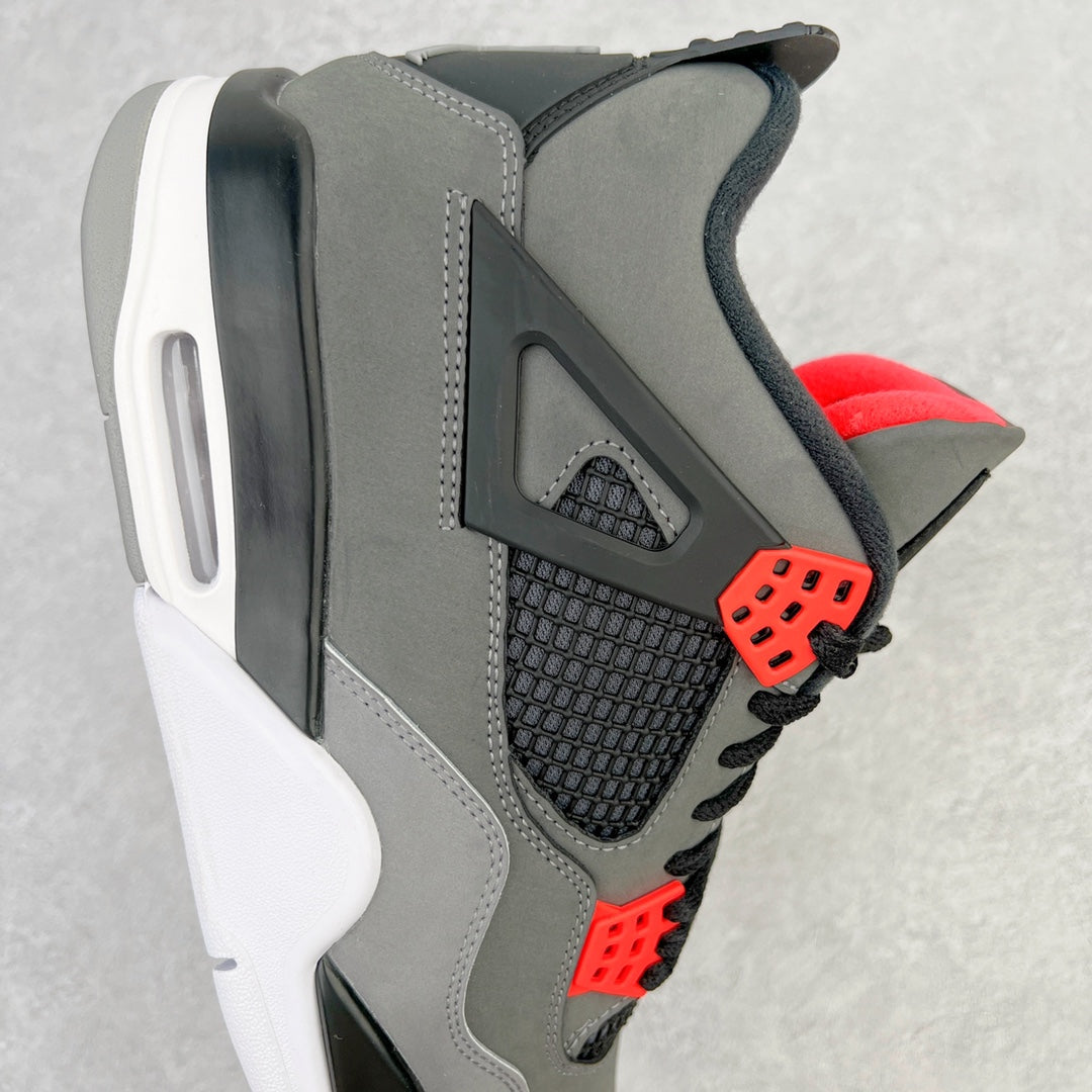 Side view grey sneaker with black mesh panel, red lace eyelets, and white midsole