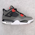 Grey and black sneakers with red accents, mesh panels, and white midsole