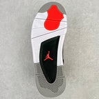 Outsole view of grey sneaker with white tread and red traction section