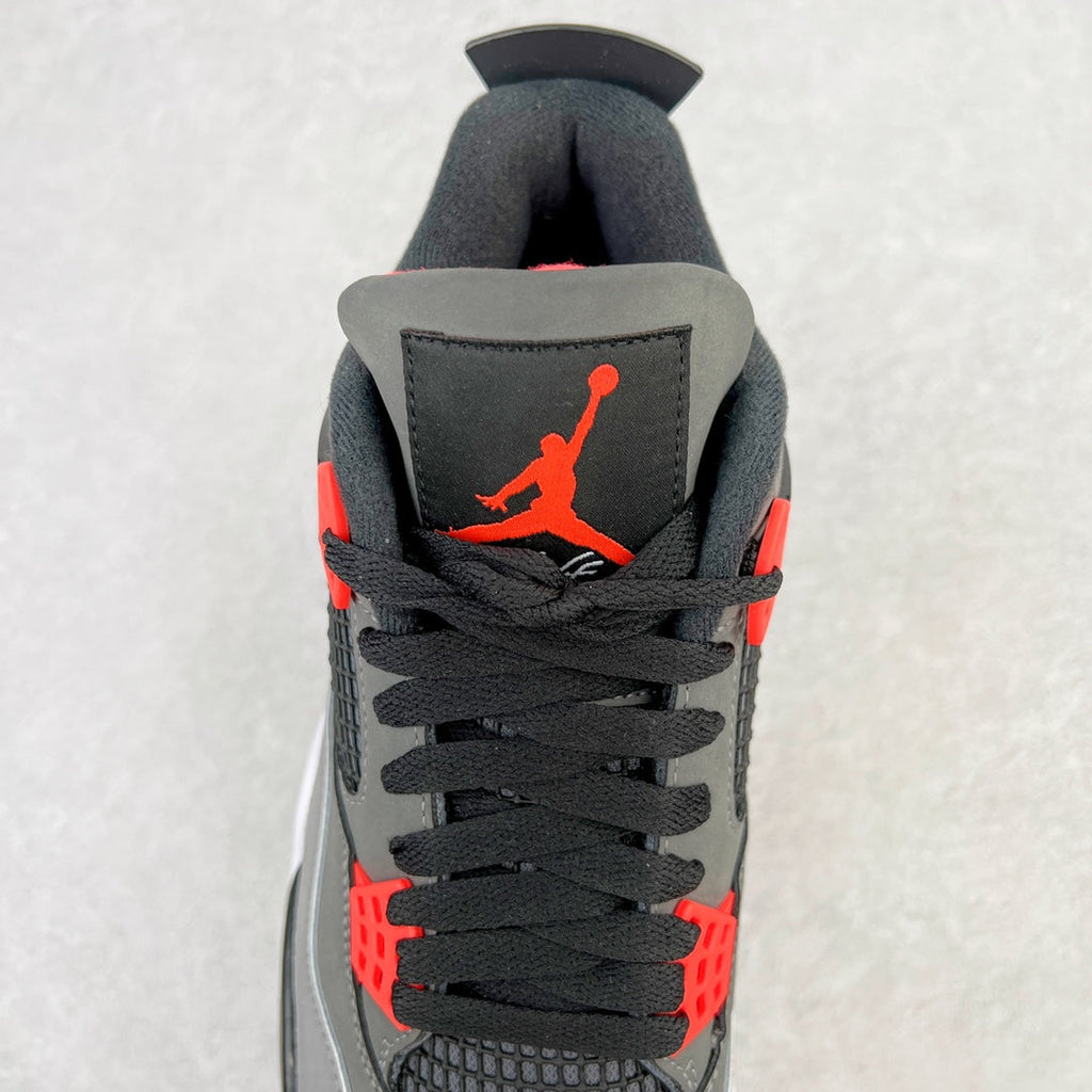 Back view sneaker with black collar, red accents, and black wing emblem