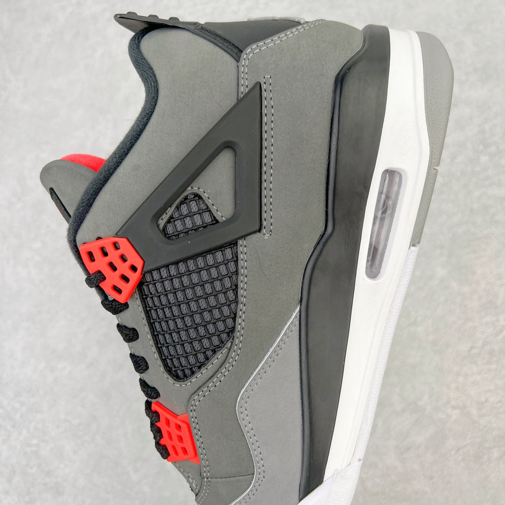 Side view grey sneaker with red lace eyelets and black mesh quarter panel