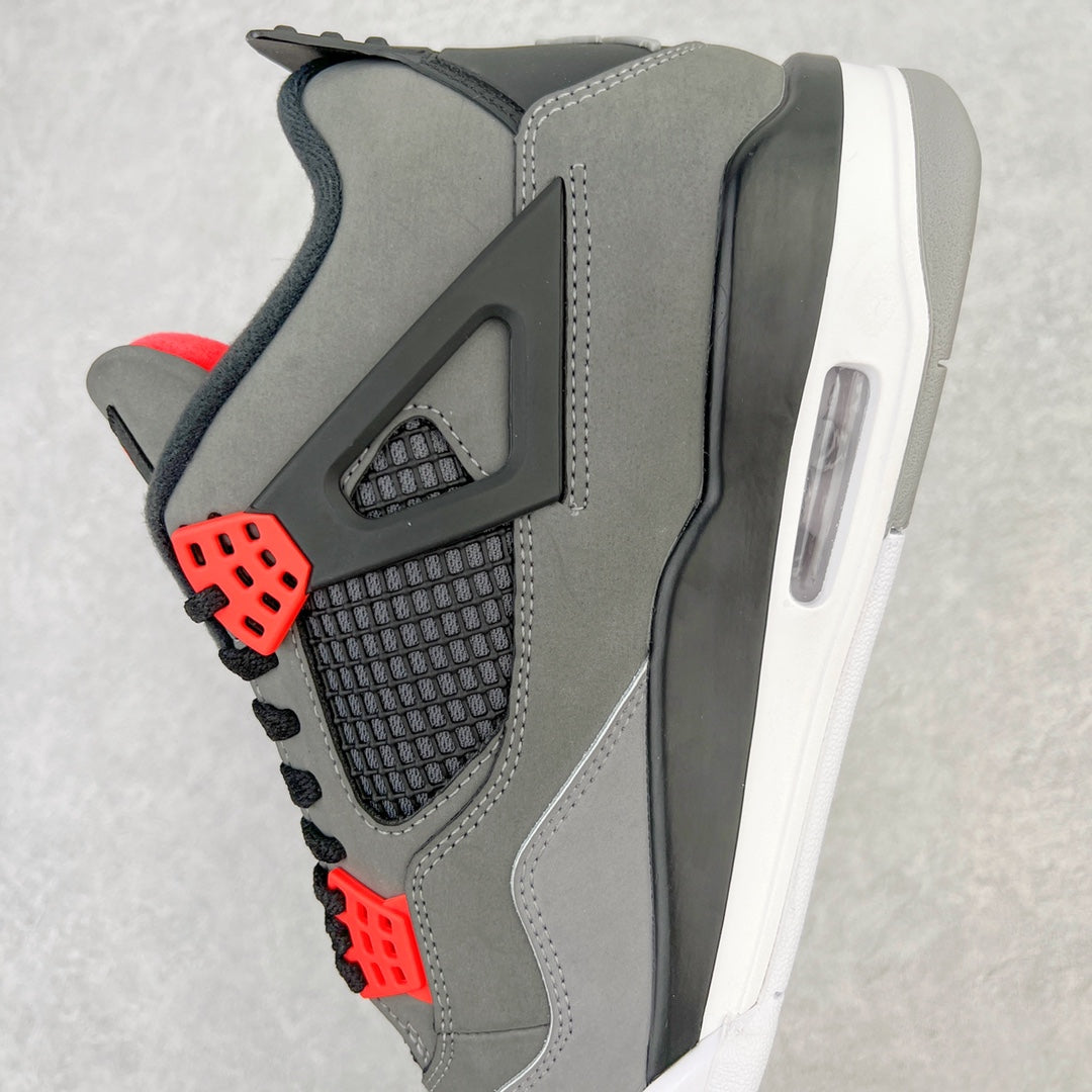 Side view grey sneaker with red lace eyelets and black mesh quarter panel