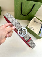 Gucci GG canvas belt with silver G buckle and red leather trim