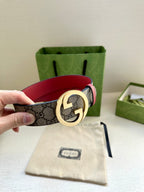Gucci GG canvas belt with gold G buckle and red leather strap
