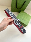Gucci belt with navy-and-white logo canvas strap and silver-tone GG buckle