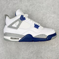 White mid-top sneakers with navy accents, lace-up, and visible air-cushion sole