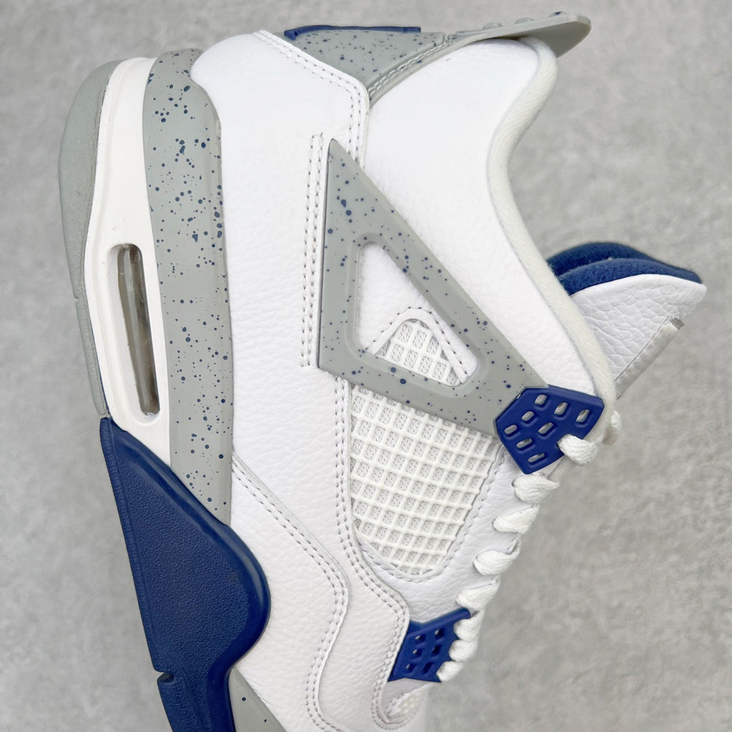 White mid-top sneaker side view with gray speckled wing panel and navy outsole