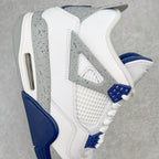 White mid-top sneaker side view with gray speckled wing panel and navy outsole