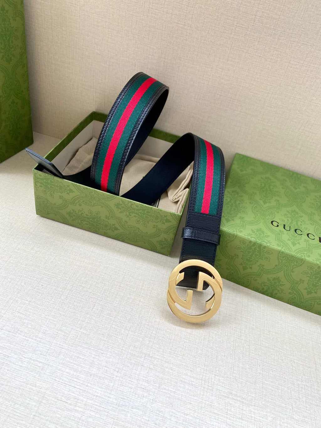 Gucci belt with navy strap, multicolor web stripe, gold-toned double-G buckle