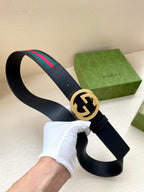 Gucci belt, dark navy strap with multicolor web stripe, gold double-G buckle