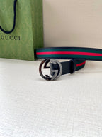 Gucci belt, navy strap with multicolor web stripe, silver double-G buckle
