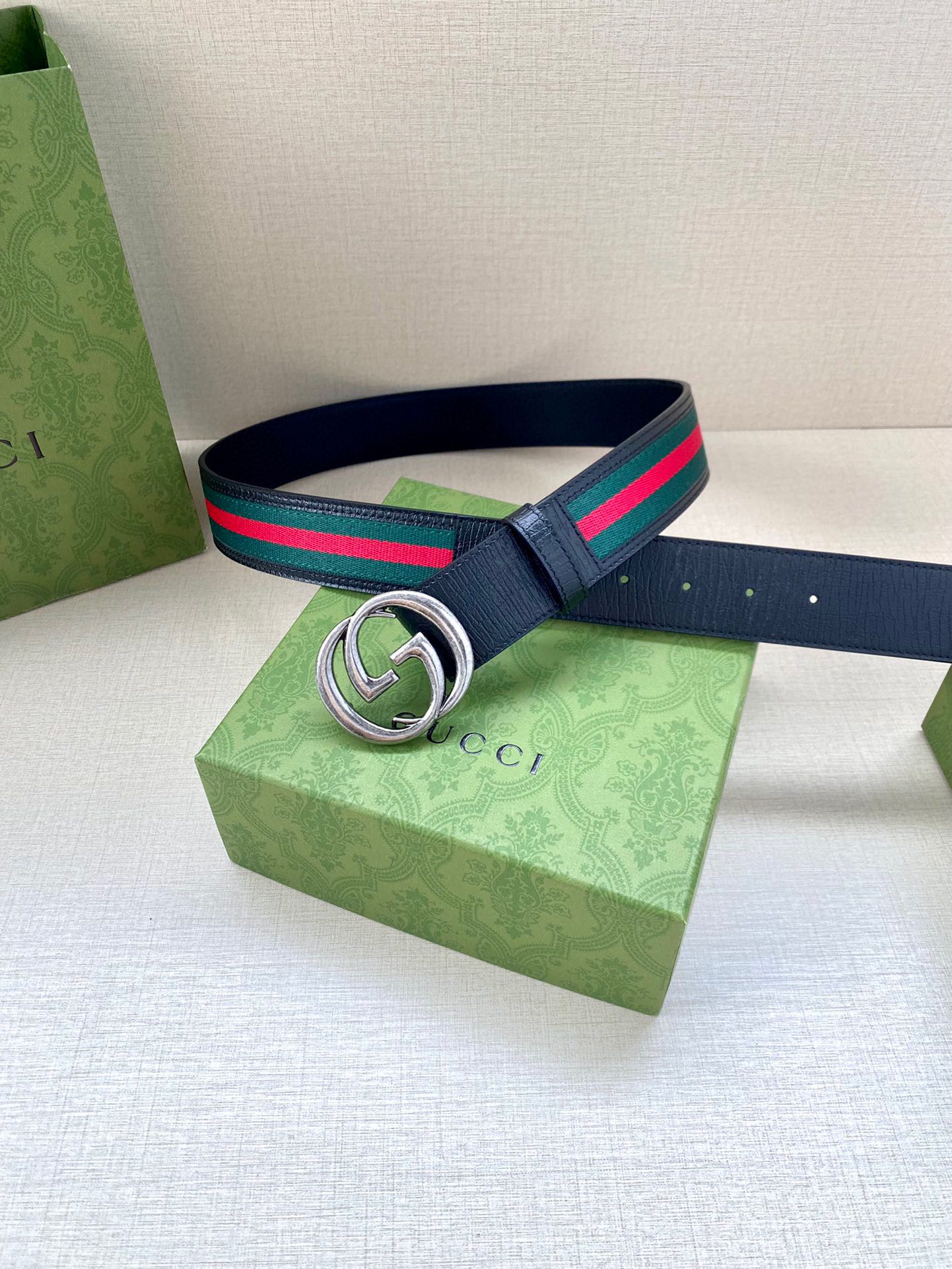 Navy leather belt with silver double-G buckle and multicolor striped band