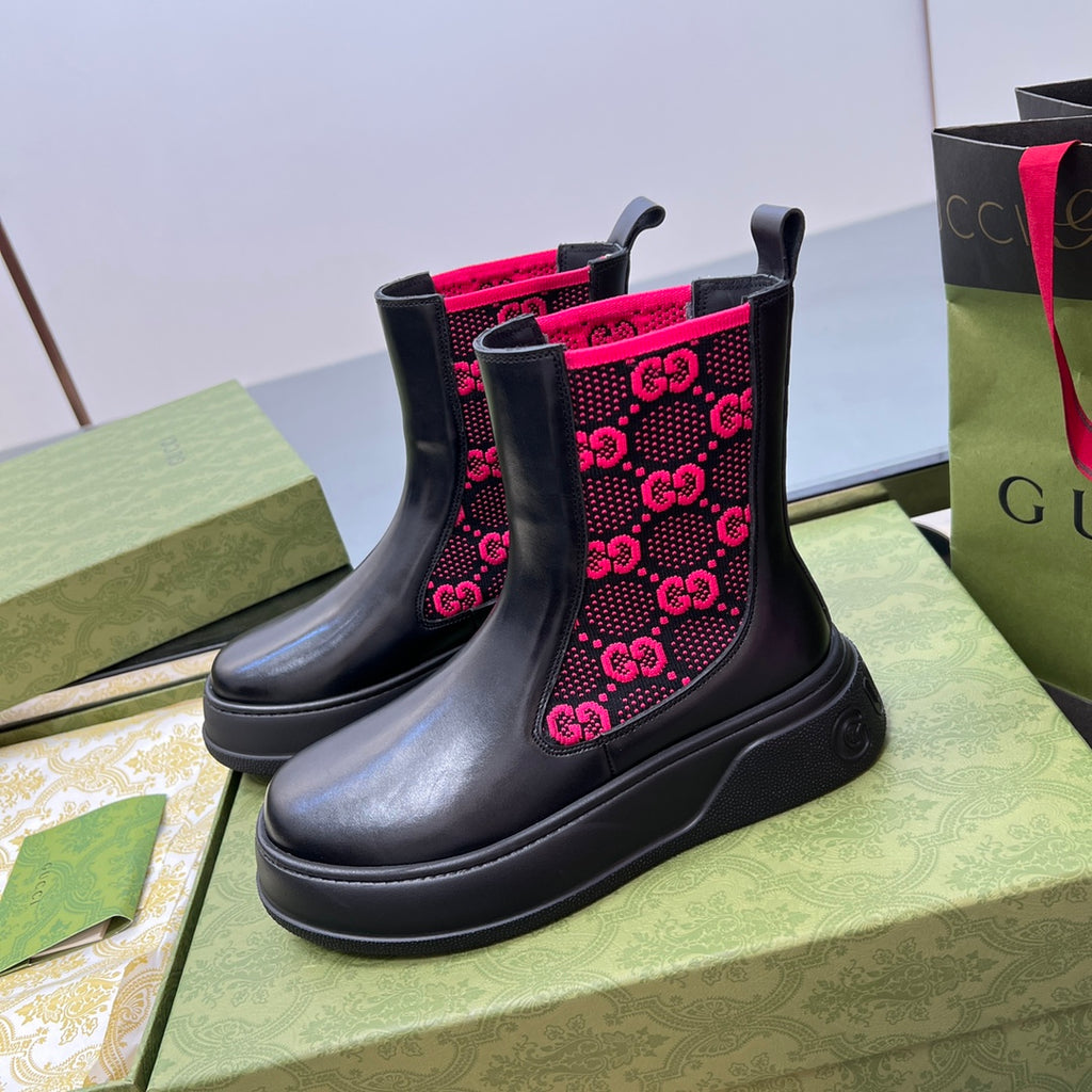 Black chelsea boots with pink GG logo pattern on the elastic side panels and platform sole