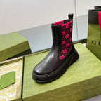 Black chelsea boot with pink GG logo pattern on elastic side and thick platform sole
