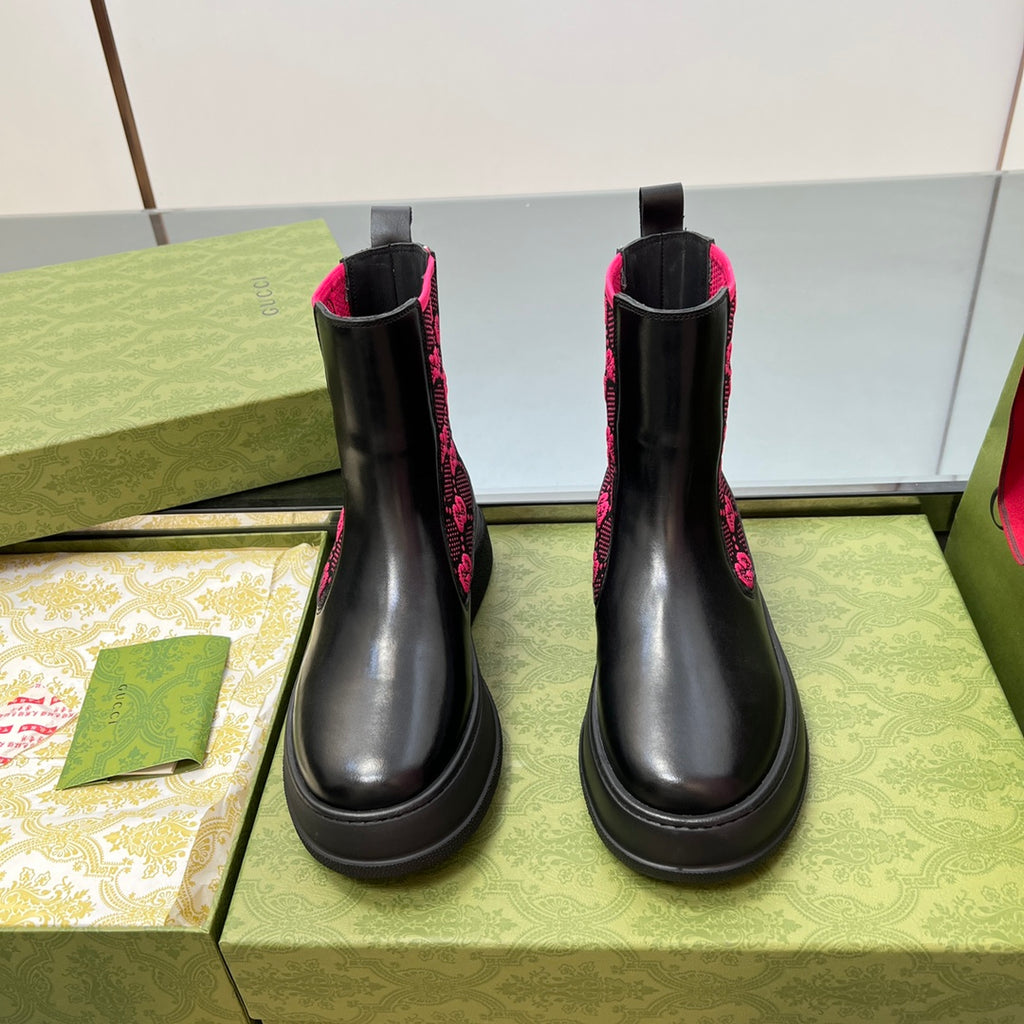 Black unisex chelsea boots with pink GG patterned panels and elastic pull tabs