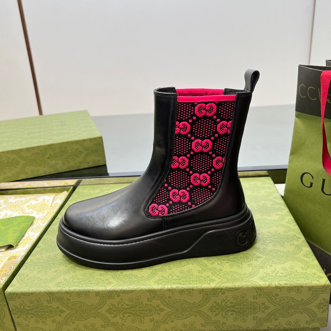 Black unisex chelsea boot with pink GG logo patterned side panels and pull-tab collar