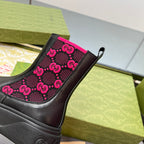 Black chelsea boot quarter panel with pink GG logo pattern and elastic side gore