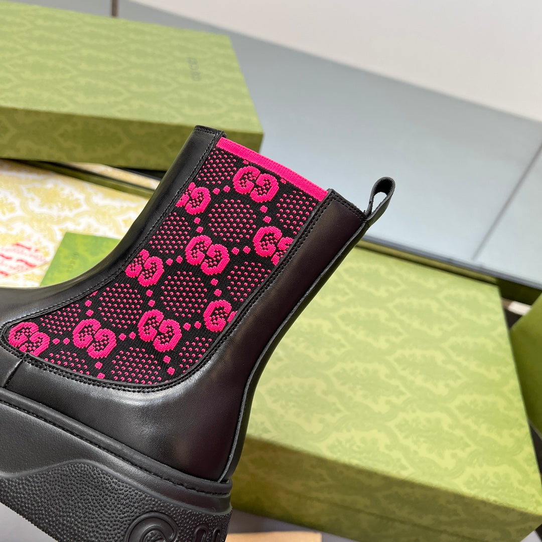 Black chelsea boot quarter panel with pink GG logo pattern and elastic side gore