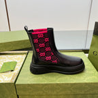Black unisex chelsea boot with pink GG logo pattern on the side gore and thick sole