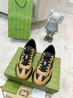 Gucci unisex sneakers, tan and black low-top with lace-up and contrasting paneling