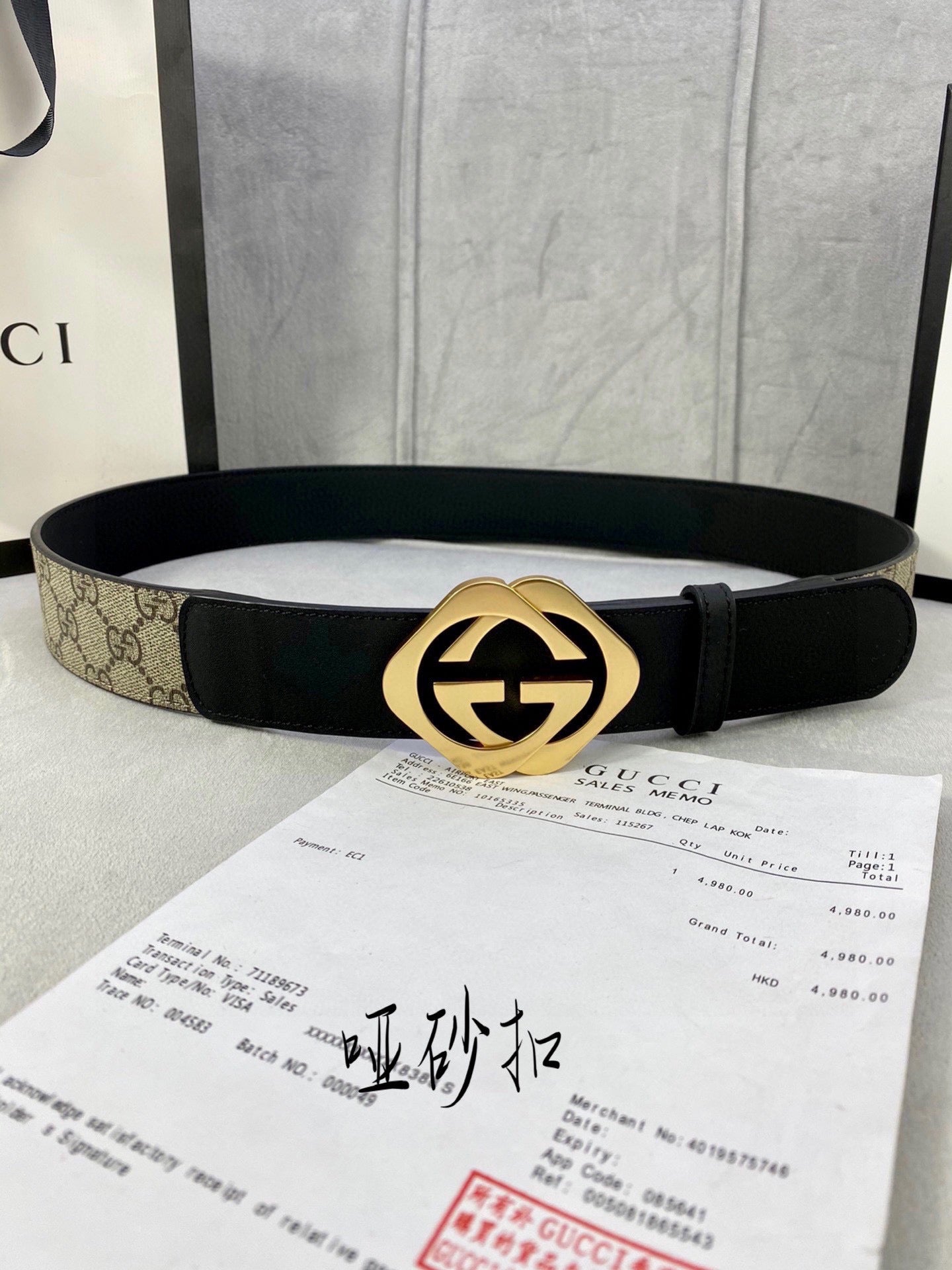 Gucci belt with black leather strap and gold-toned GG logo buckle