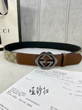 Gucci belt in GG-pattern canvas and brown leather, silver-tone double-G buckle.