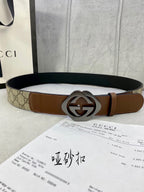Gucci belt in GG-pattern canvas and brown leather, silver-tone double-G buckle.