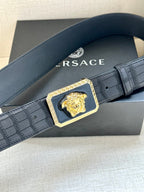 Navy leather belt with embossed pattern and square gold Medusa buckle