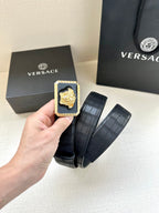Navy leather belt with embossed texture and gold square Medusa buckle