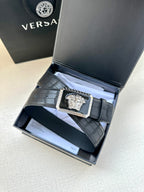 Navy leather belt with embossed texture and gold Medusa buckle in box