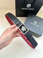 Belt: black leather-style with red underside, square engraved Medusa buckle.