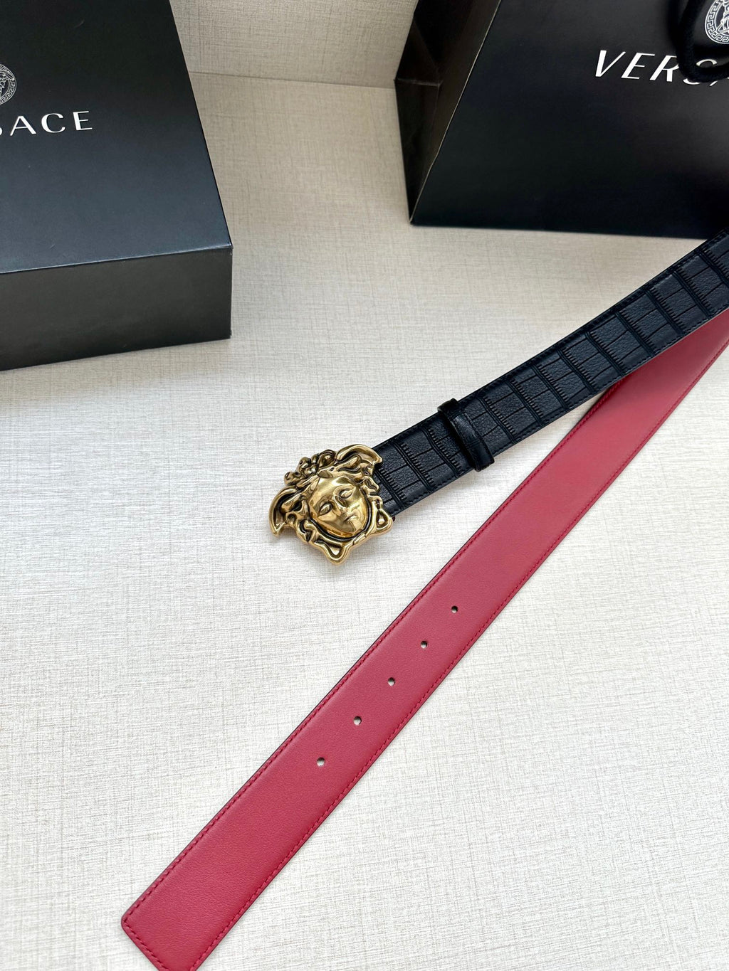 Black leather belt with red strap and gold Medusa buckle detail