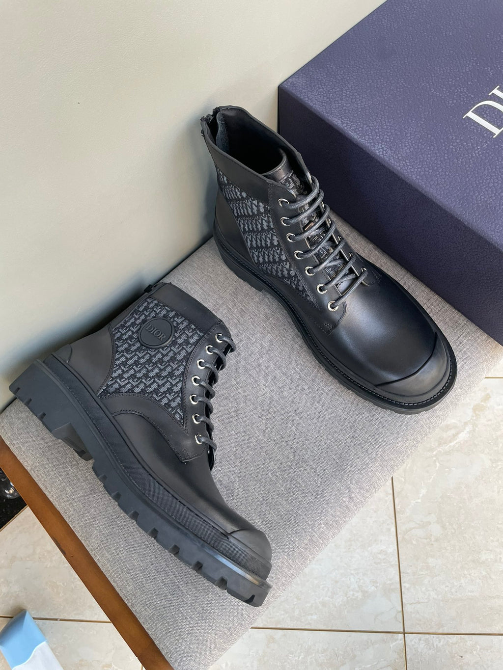 Dark leather lace-up boots with Dior monogram side panel and rugged tread sole
