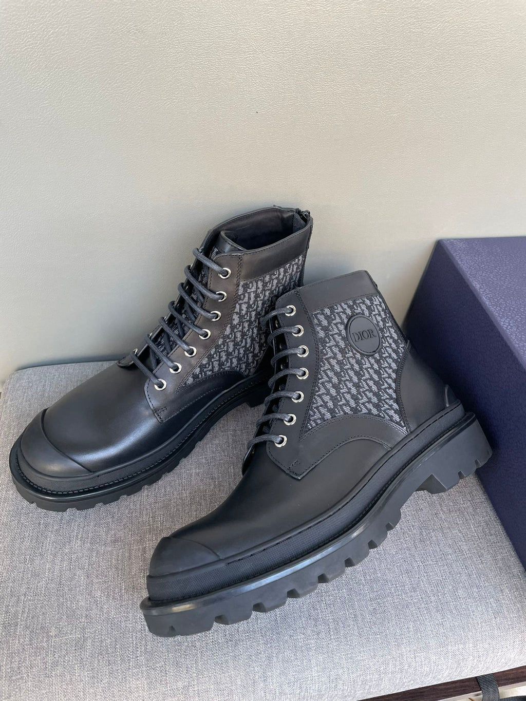 Dark Dior lace-up boots with monogram uppers and chunky rubber sole, round toe