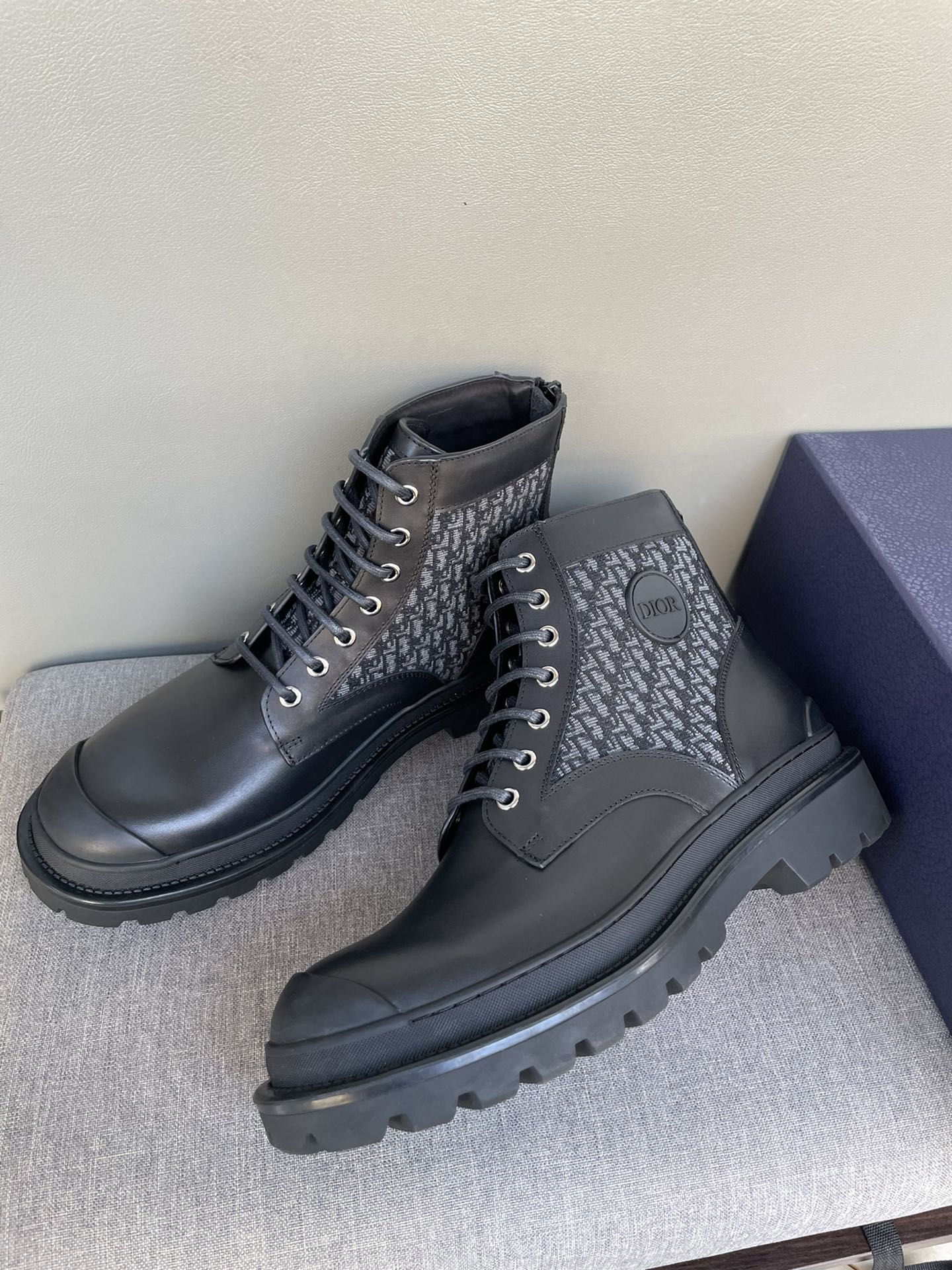 Dark Dior lace-up boots with monogram uppers and chunky rubber sole, round toe