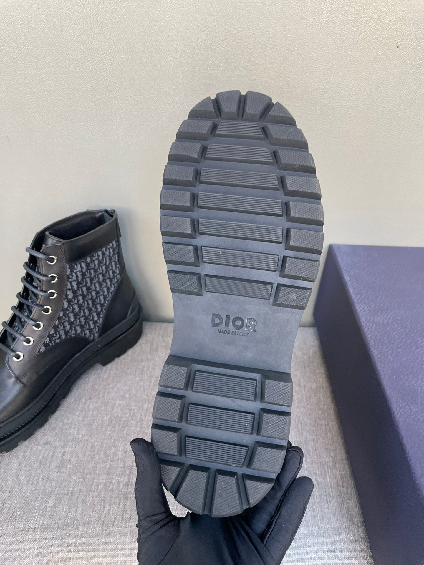 Dior boot outsoles with squared tread lugs and stacked rubber heel