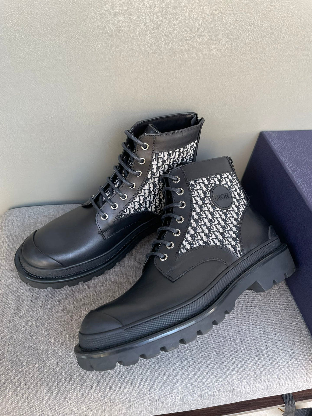 Pair of Dior lace-up ankle boots, black leather with monogram knit panels and laces