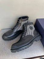 Pair of Dior lace-up ankle boots, black leather with monogram knit panels and laces