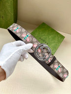 Gucci belt with GG canvas and colorful floral print, black leather strap, round buckle