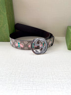Gucci belt with GG canvas floral pattern and dark leather, round silver buckle