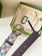Gucci belt laid with dust bag: GG canvas floral strap and dark leather, gold round buckle