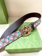 Gucci belt with GG canvas floral pattern and dark leather strap, gold-toned round buckle