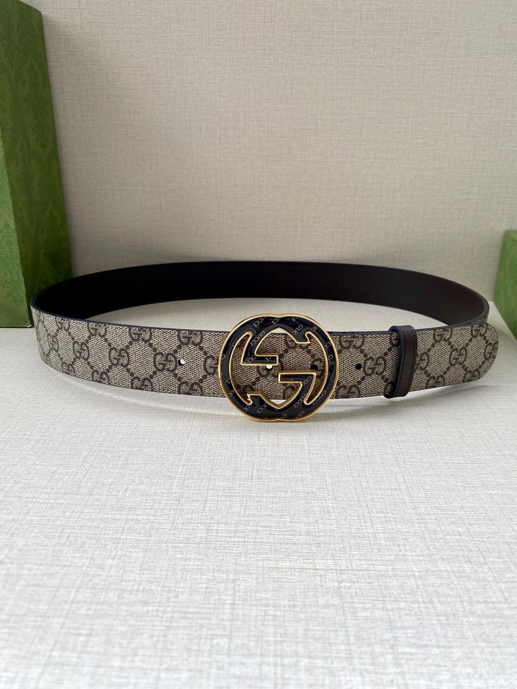 Gucci belt with GG monogram strap and gold-tone interlocking horse buckle