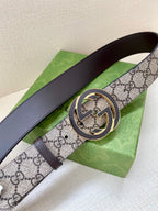 Gucci belt with GG monogram strap, round interlocking buckle, dark leather edges