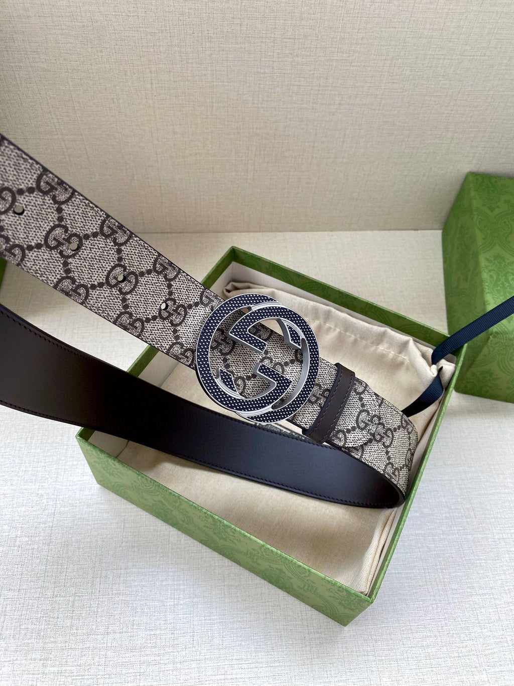 Gucci belt shown in box with GG monogram strap and interlocking G buckle