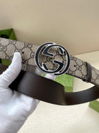 Gucci belt with GG monogram canvas strap and dark leather panel, silver-toned logo buckle