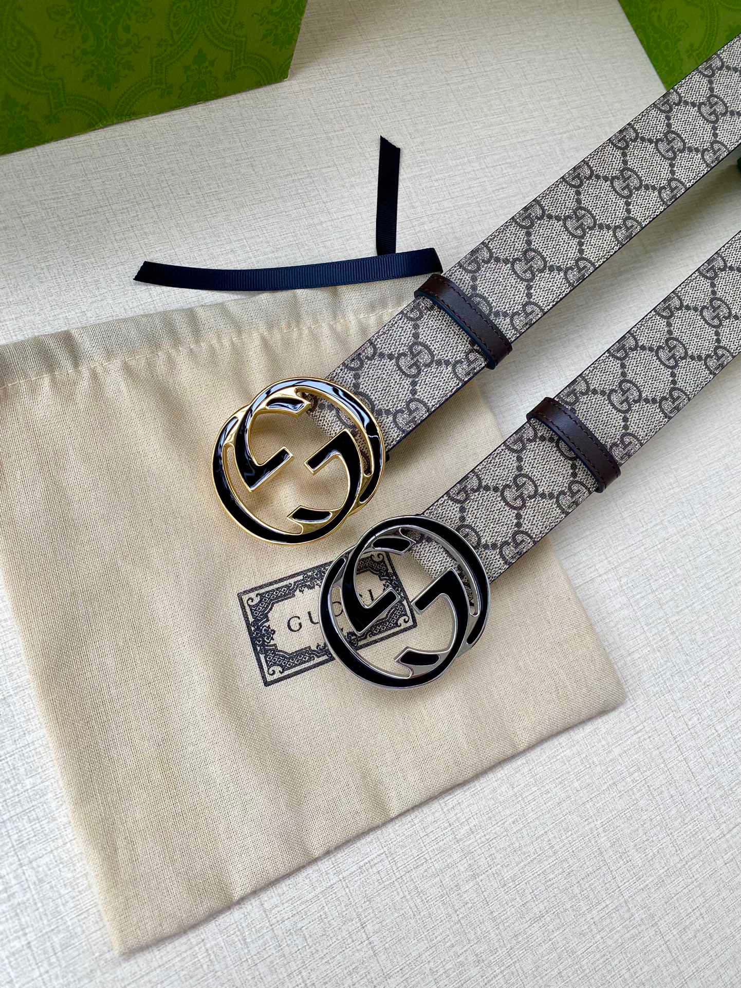 Gucci belt with GG monogram canvas strap and dark leather back, silver logo buckle